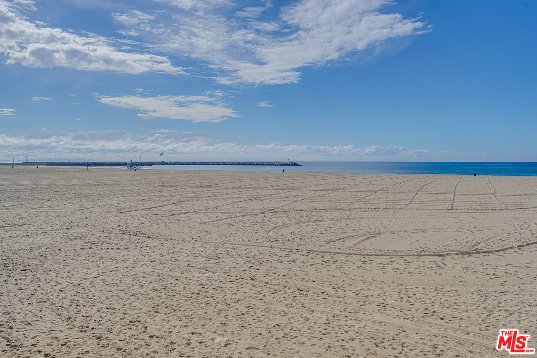 4 Quarterdeck Street, Unit 101 Marina del Rey, CA 90292 - Photo 15 of 29 a view of an ocean beach and mountain