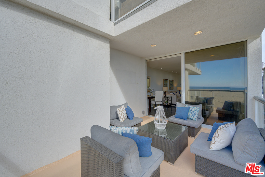 4 Quarterdeck Street, Unit 101 Marina del Rey, CA 90292 - Photo 19 of 29 a living room with furniture and a fireplace