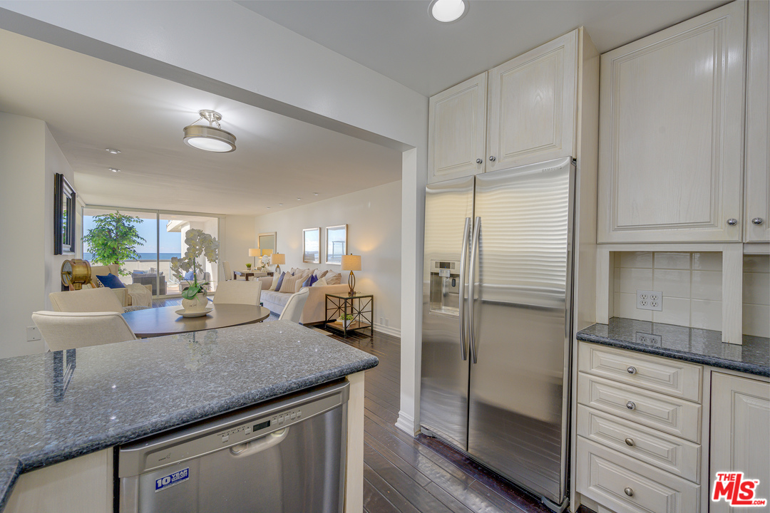 4 Quarterdeck Street, Unit 101 Marina del Rey, CA 90292 - Photo 22 of 29 a kitchen with a refrigerator and countertop