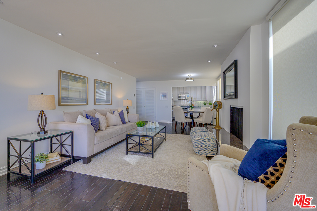 4 Quarterdeck Street, Unit 101 Marina del Rey, CA 90292 - Photo 24 of 29 a living room with furniture and wooden floor