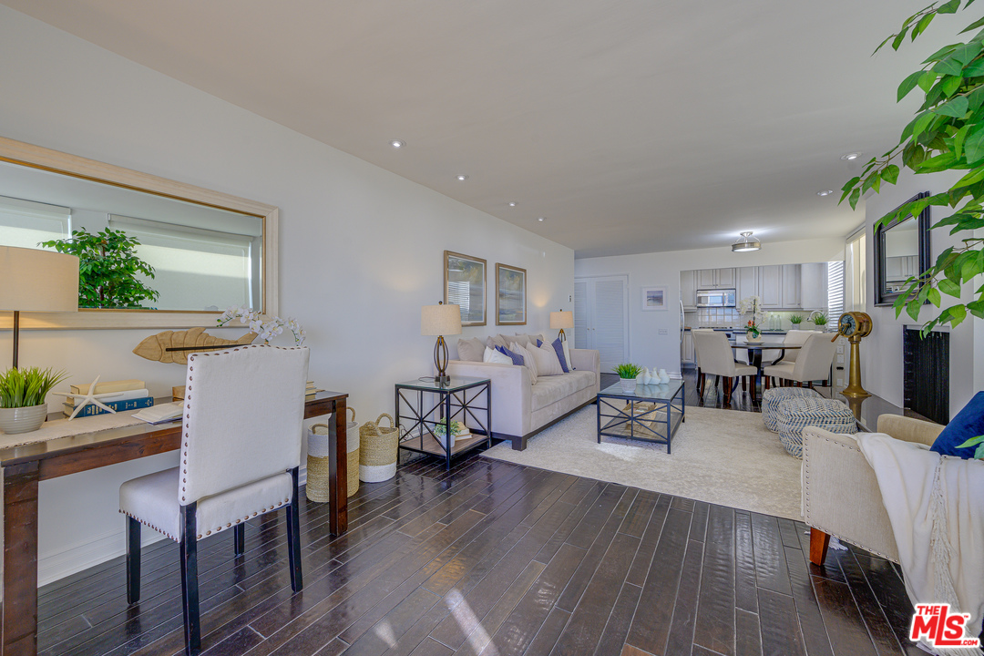 4 Quarterdeck Street, Unit 101 Marina del Rey, CA 90292 - Photo 25 of 29 a living room with furniture and a wooden floor