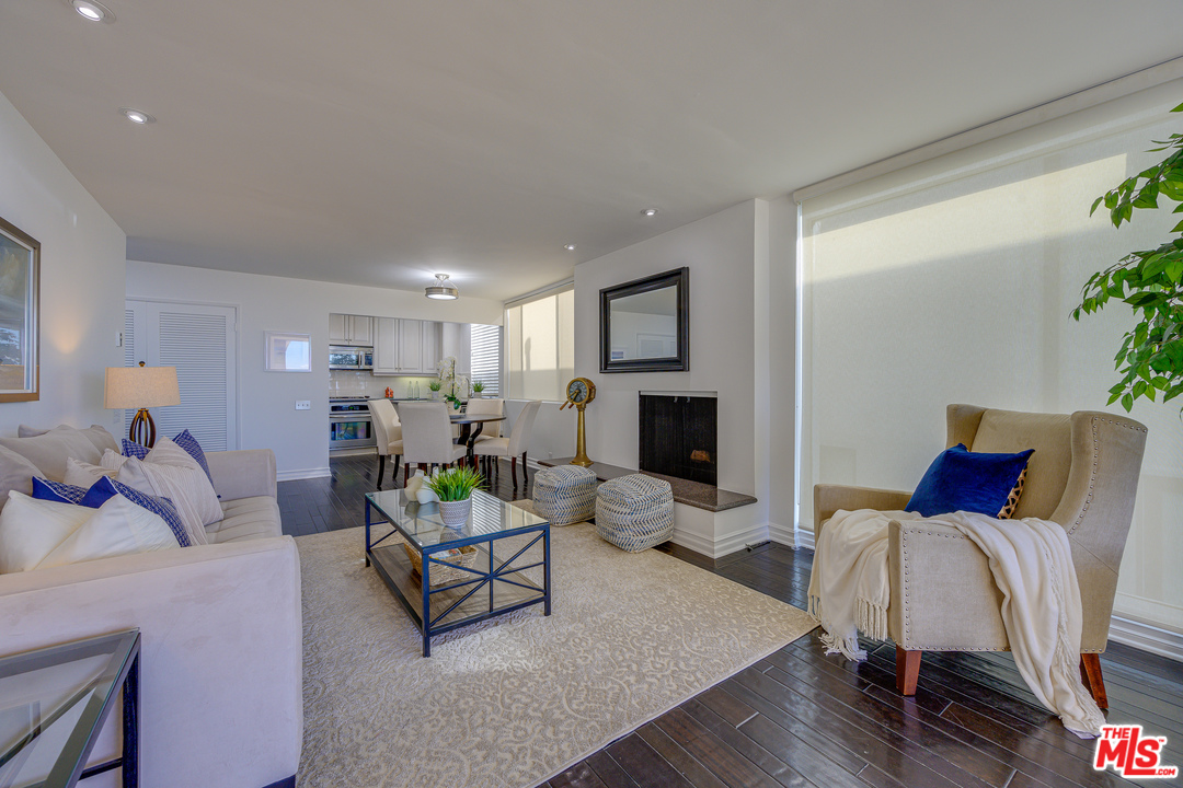 4 Quarterdeck Street, Unit 101 Marina del Rey, CA 90292 - Photo 26 of 29 a living room with furniture and a flat screen tv