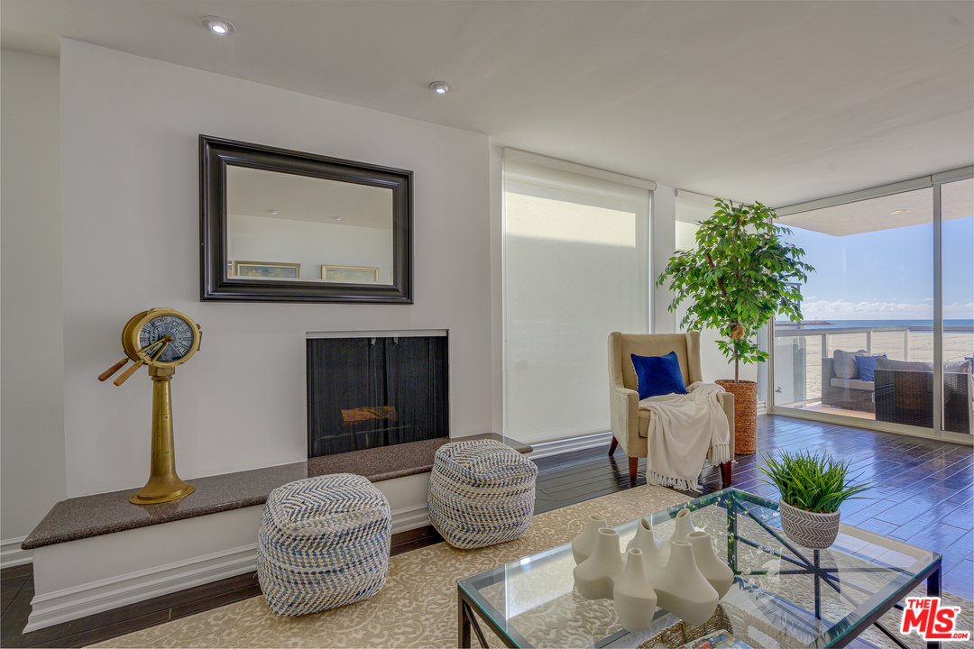 4 Quarterdeck Street, Unit 101 Marina del Rey, CA 90292 - Photo 29 of 29 a living room with furniture a potted plant and a fireplace