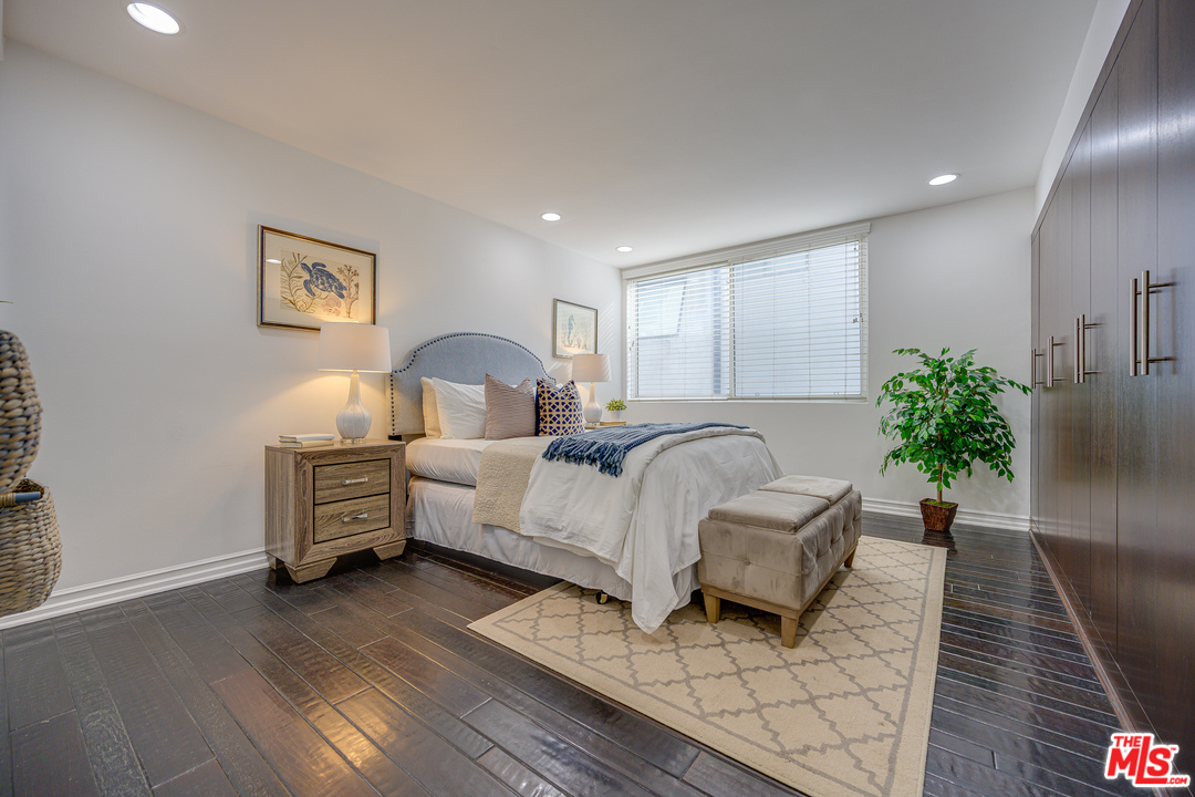 4 Quarterdeck Street, Unit 101 Marina del Rey, CA 90292 - Photo 6 of 29 a bed room with a bed and a couch