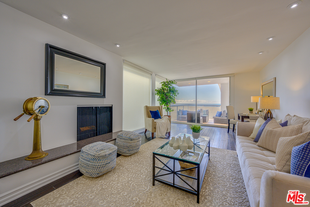 4 Quarterdeck Street, Unit 101 Marina del Rey, CA 90292 - Photo 10 of 29 a living room with furniture and a chandelier