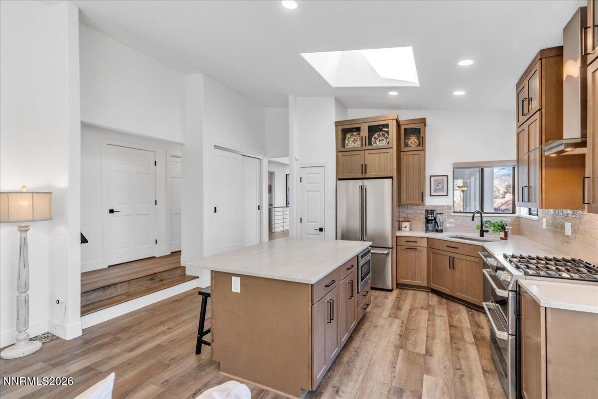 1243 Sharrow Way Carson City, NV 89703 - Photo 21 of 67 a kitchen that has a lot of cabinets a sink and a stove in it