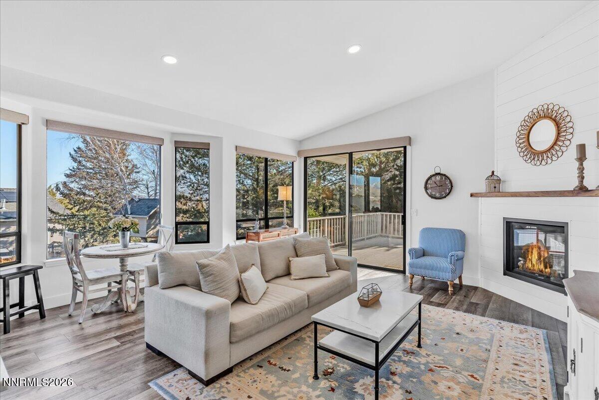 1243 Sharrow Way Carson City, NV 89703 - Photo 28 of 67 a living room with furniture fireplace and a large window