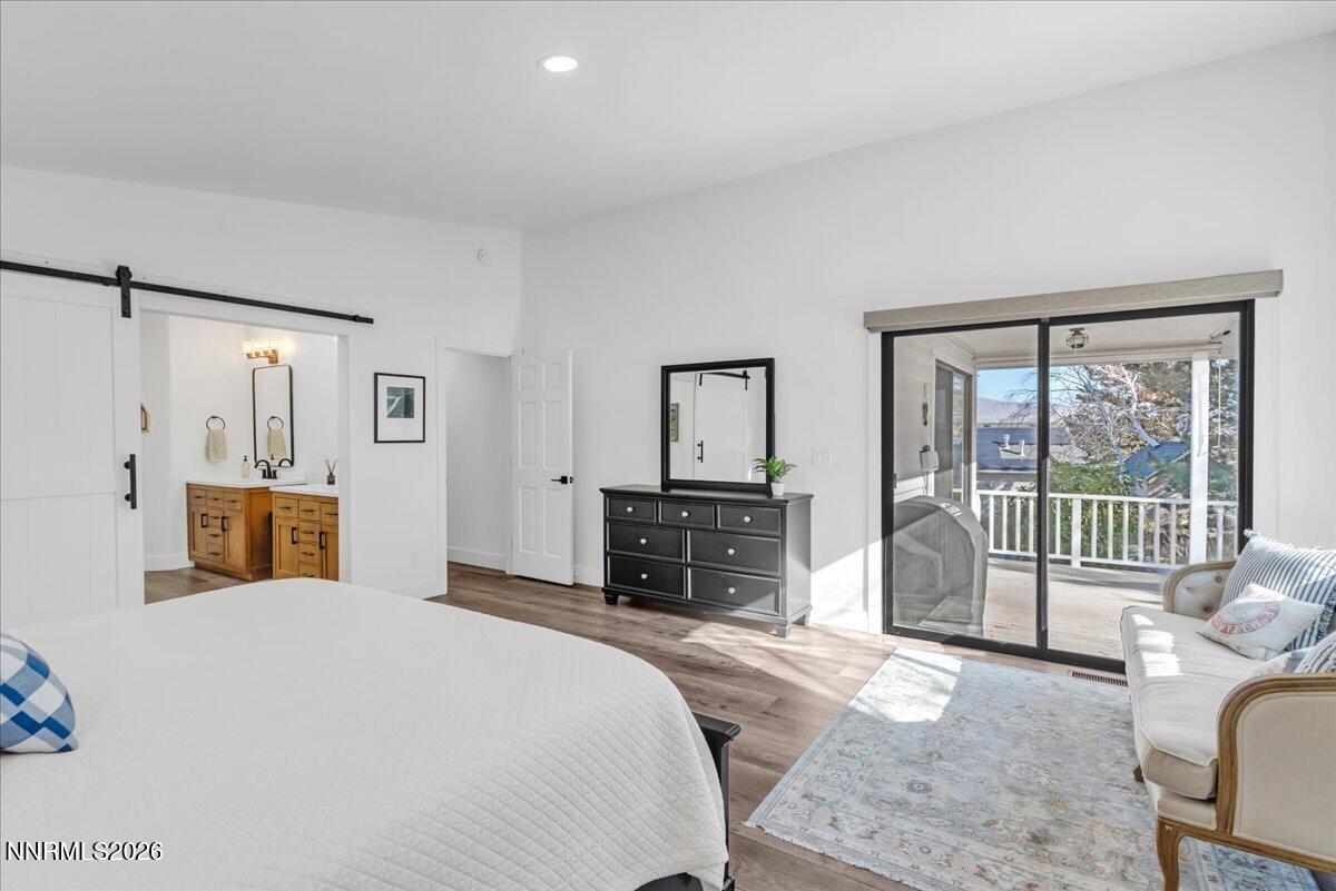 1243 Sharrow Way Carson City, NV 89703 - Photo 36 of 67 a bedroom with a balcony a bed and a television