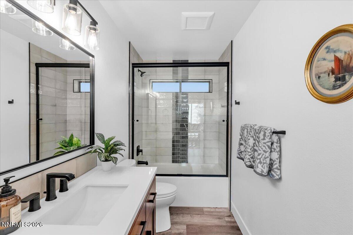 1243 Sharrow Way Carson City, NV 89703 - Photo 44 of 67 a bathroom with a bathtub and a sink