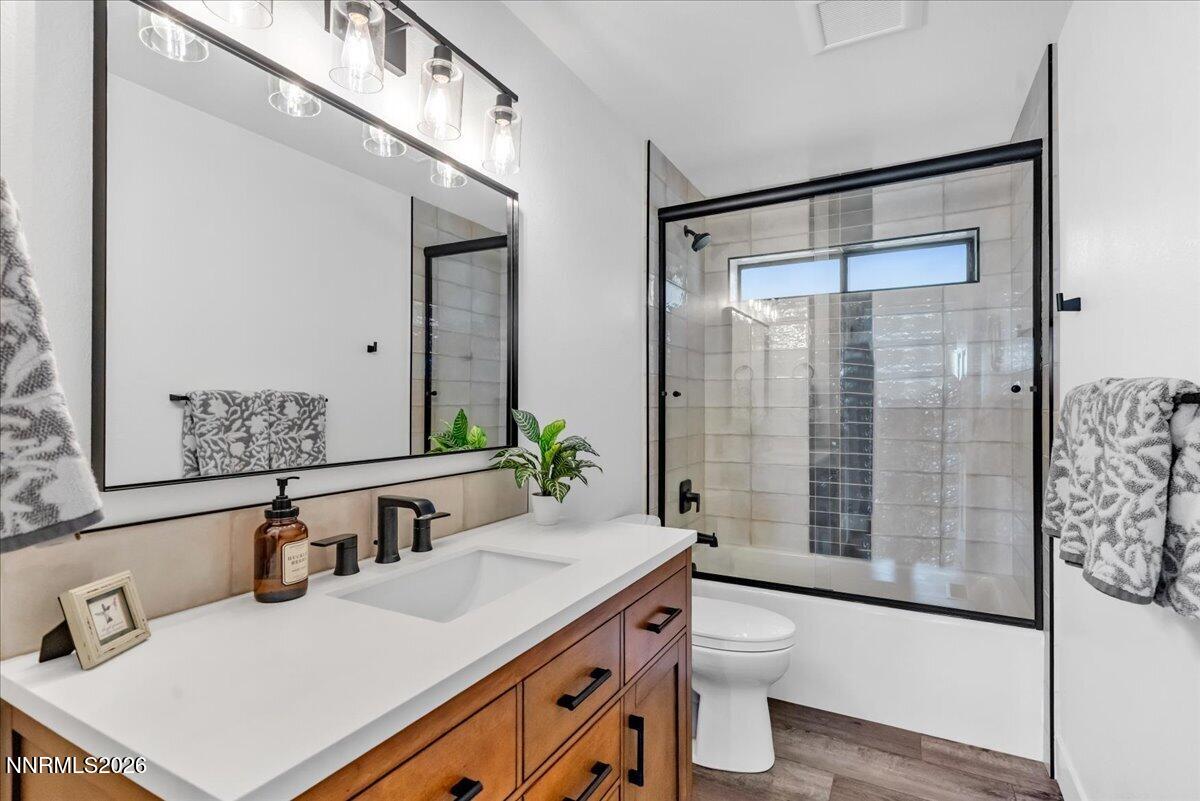 1243 Sharrow Way Carson City, NV 89703 - Photo 45 of 67 a bathroom with a sink and a mirror
