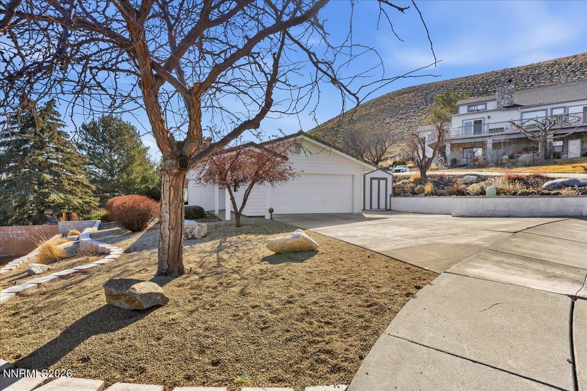 1243 Sharrow Way Carson City, NV 89703 - Photo 48 of 67 a view of a yard with an outdoor space