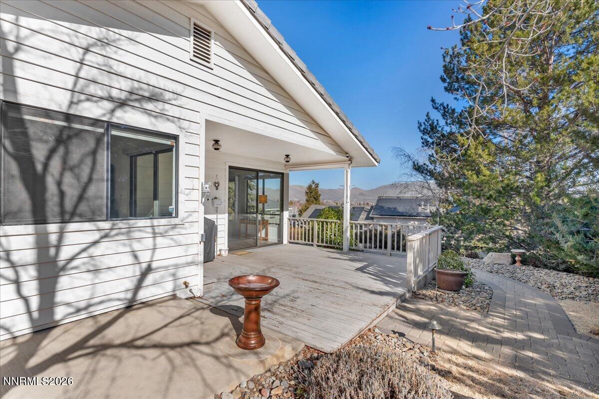 1243 Sharrow Way Carson City, NV 89703 - Photo 52 of 67 a view of a house with backyard and sitting area
