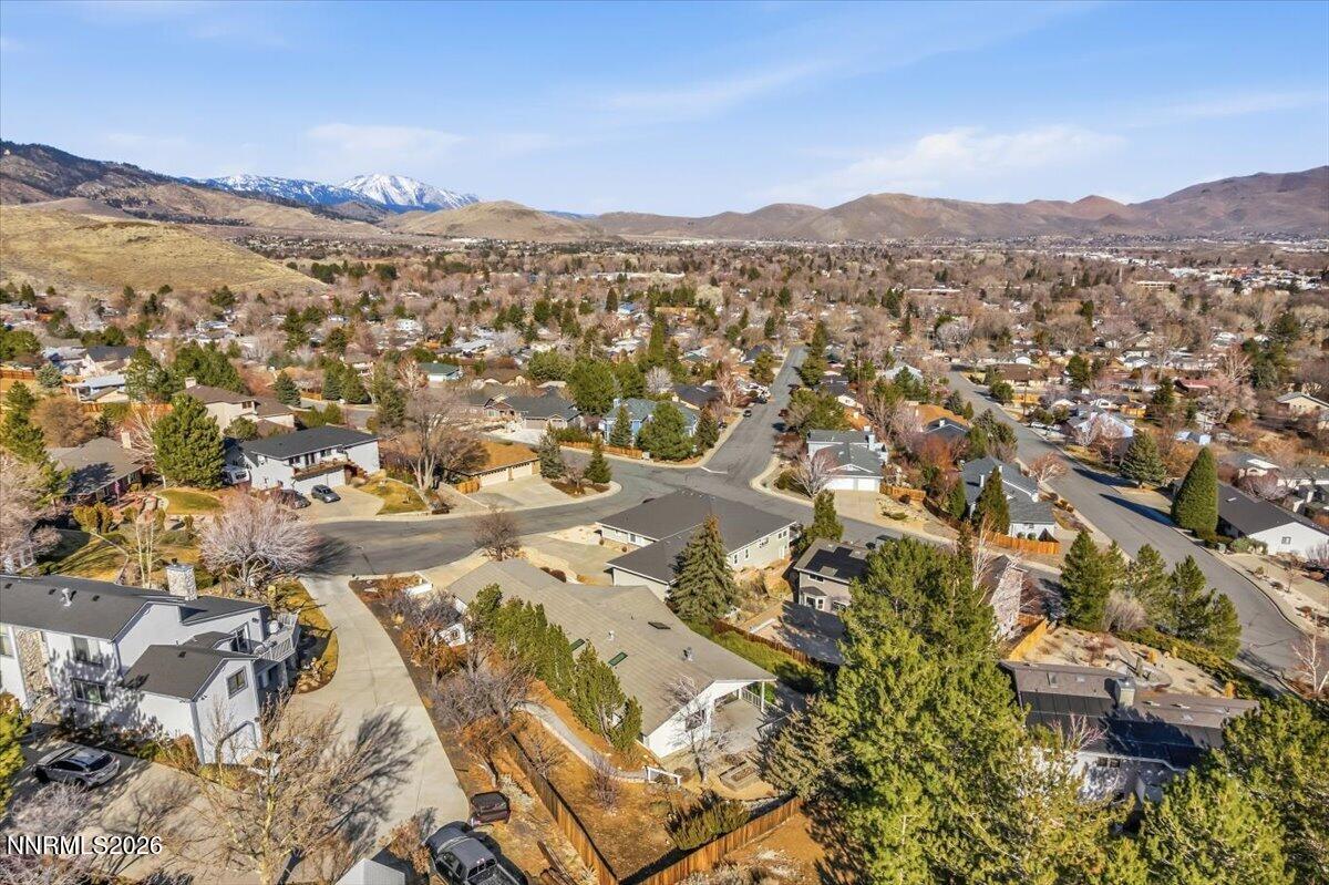 1243 Sharrow Way Carson City, NV 89703 - Photo 67 of 67 an aerial view of residential houses with outdoor space and trees