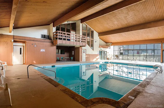 a view of a swimming pool with a patio