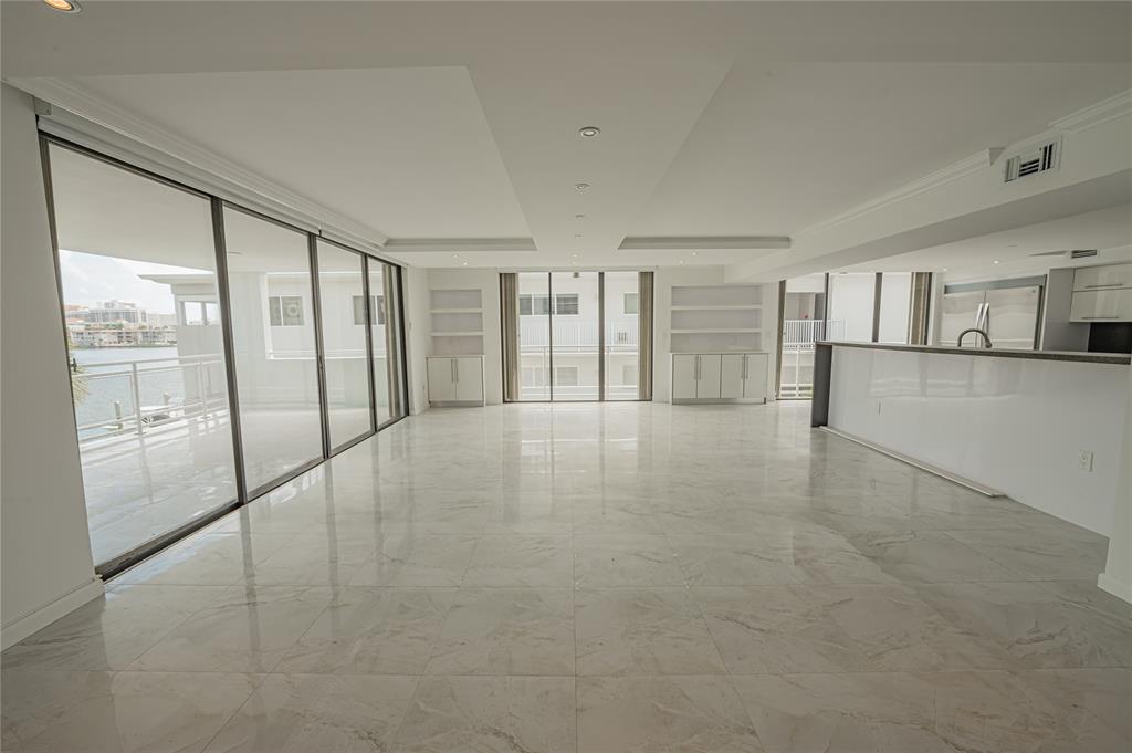 468 Golden Isles Drive, Unit 402 Hallandale Beach, FL 33009 - Photo 12 of 53 a view of an empty room with a window