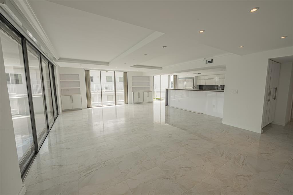 468 Golden Isles Drive, Unit 402 Hallandale Beach, FL 33009 - Photo 13 of 53 a view of an empty room with a window