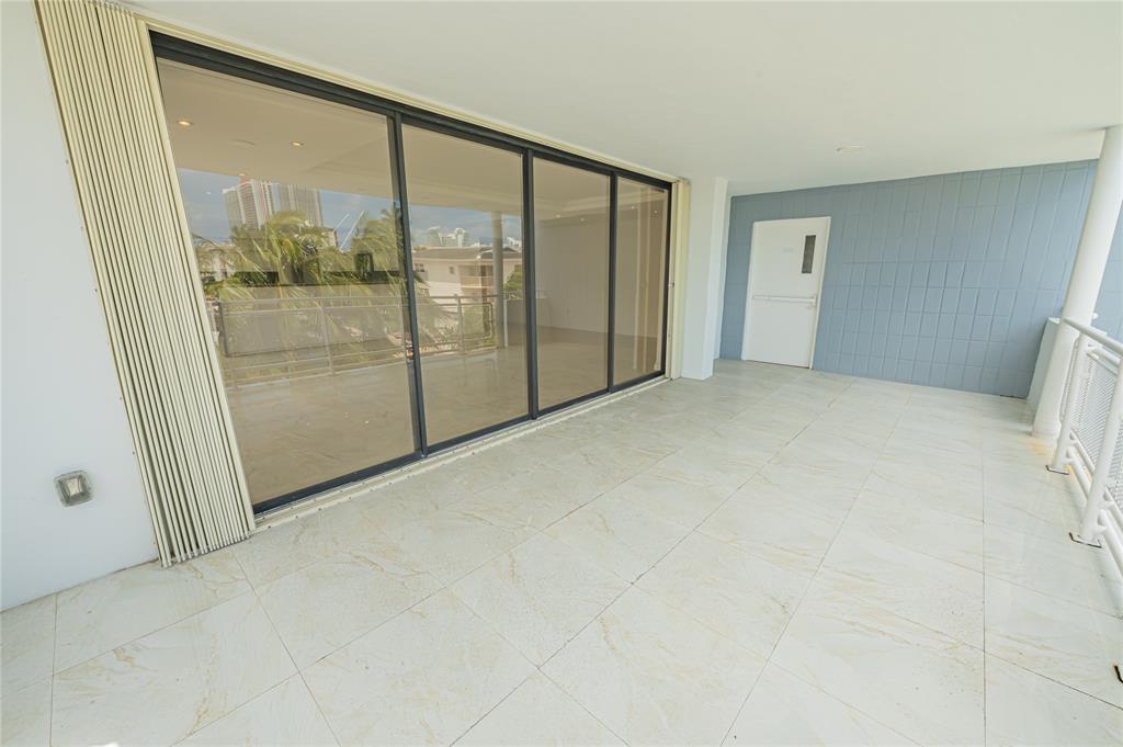 468 Golden Isles Drive, Unit 402 Hallandale Beach, FL 33009 - Photo 19 of 53 a view of an empty room with windows