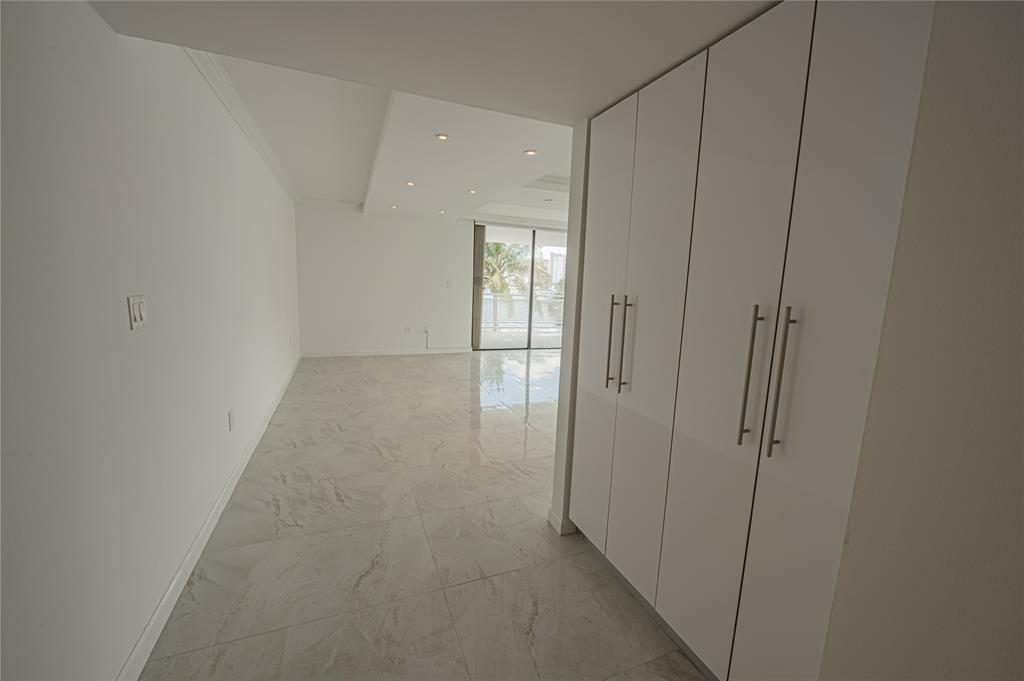 468 Golden Isles Drive, Unit 402 Hallandale Beach, FL 33009 - Photo 10 of 53 a view of a hallway