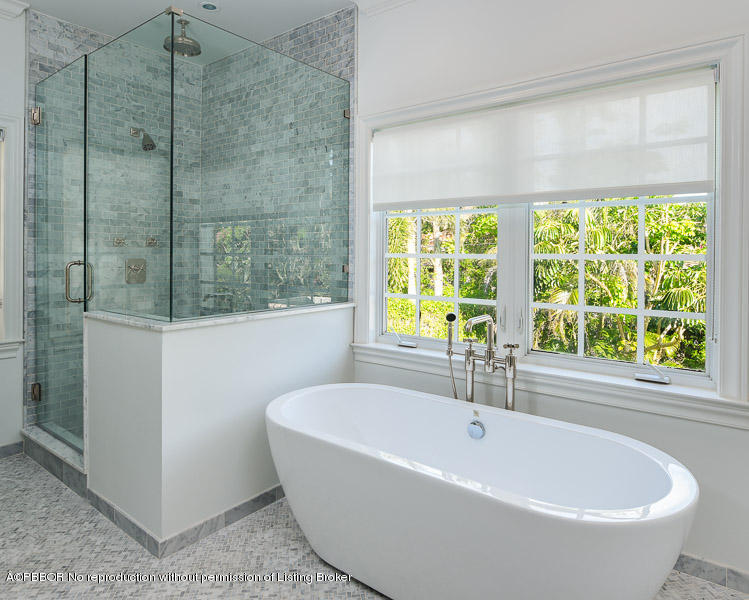 277 Cordova Road West Palm Beach, FL 33401 - Photo 7 of 10 a white bath tub sitting in a bathroom next to a window