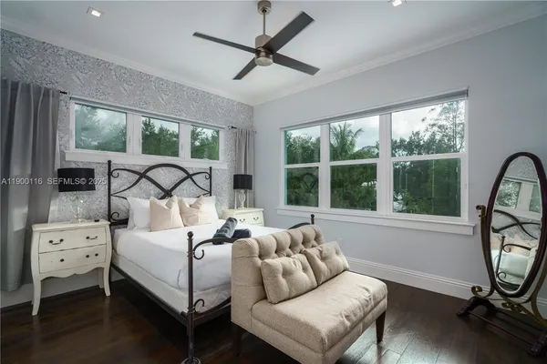 a living room filled with furniture hardwood floor and a table