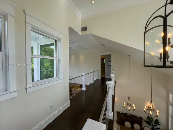 a view of a living room and chandelier