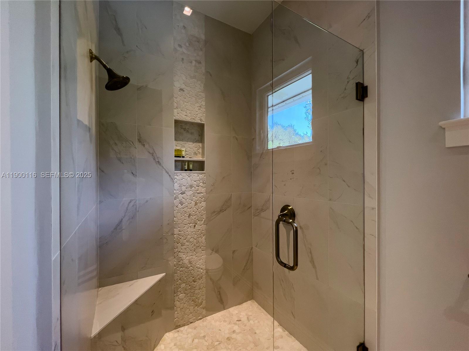 545 Southwest Indianola Street Stuart, FL 34994 - Photo 38 of 64 a bathroom with a shower