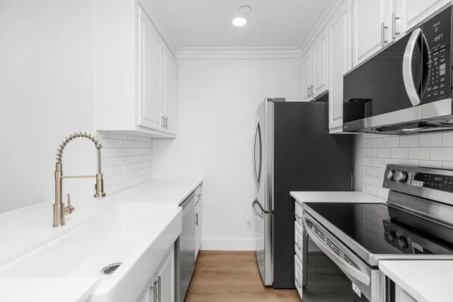a bathroom with a sink and a microwave