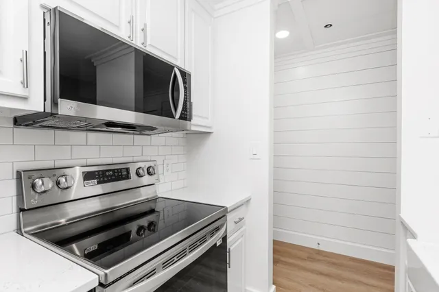 a kitchen with a sink and a refrigerator