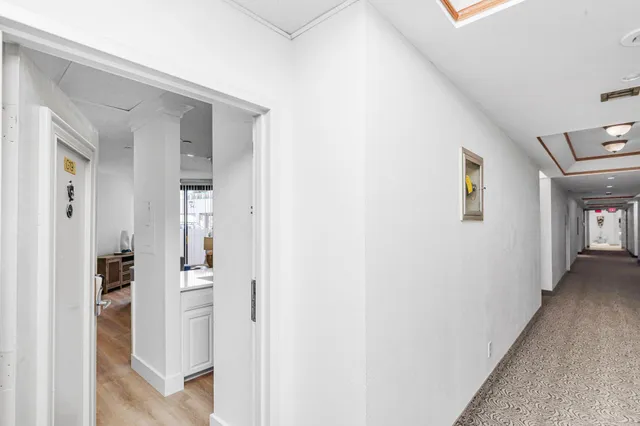 a view of a kitchen with a sink and dishwasher