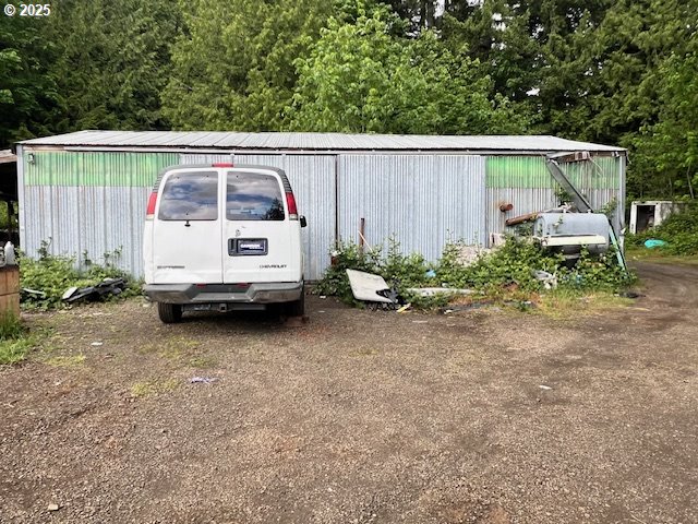 23942 South Powder Road Beavercreek, OR 97004 - Photo 4 of 5 a view of backyard with tub and trees