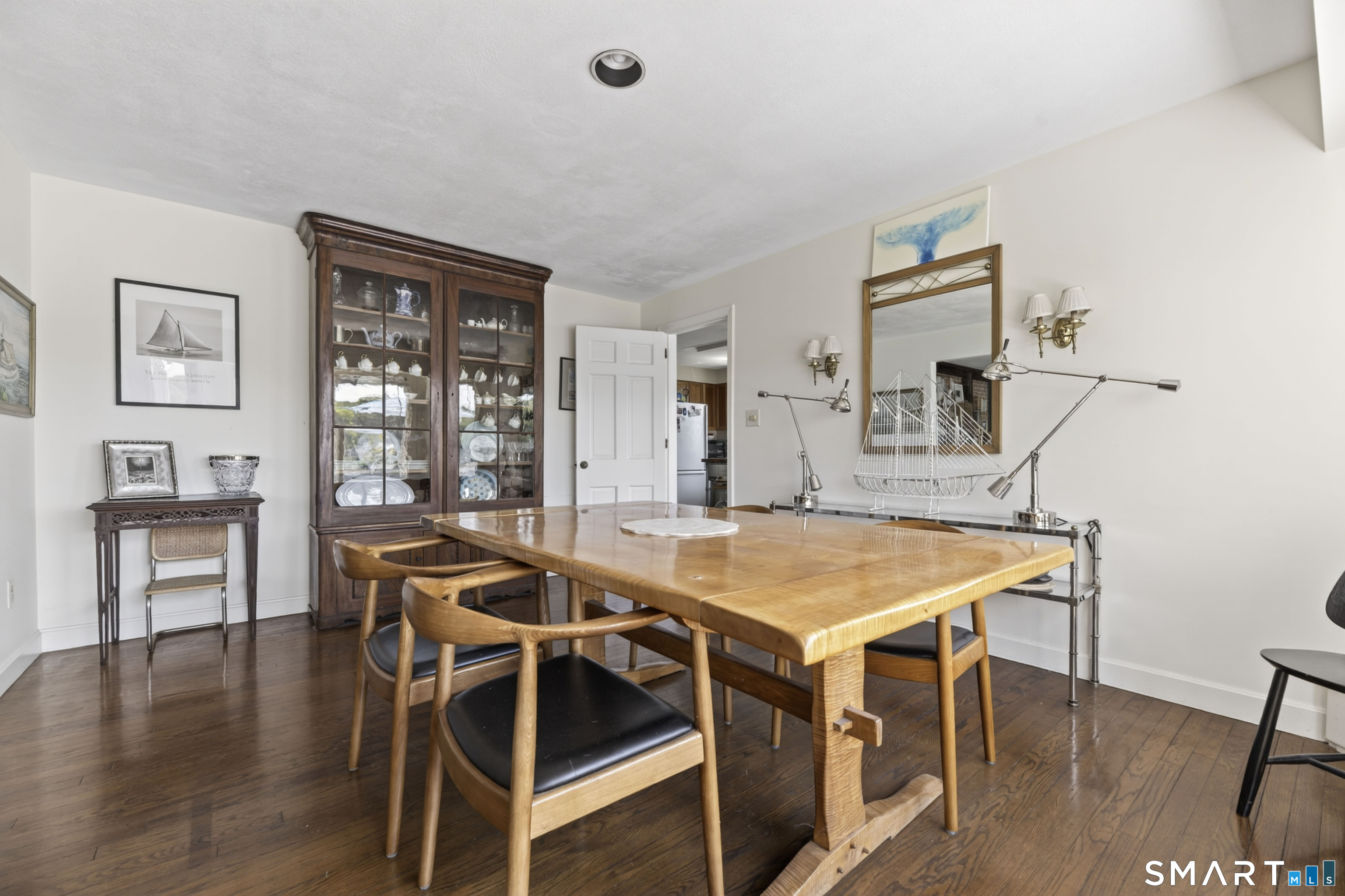 27 Wilbur Road Stonington, CT 06378 - Photo 11 of 40 a view of a dining room with furniture and wooden floor