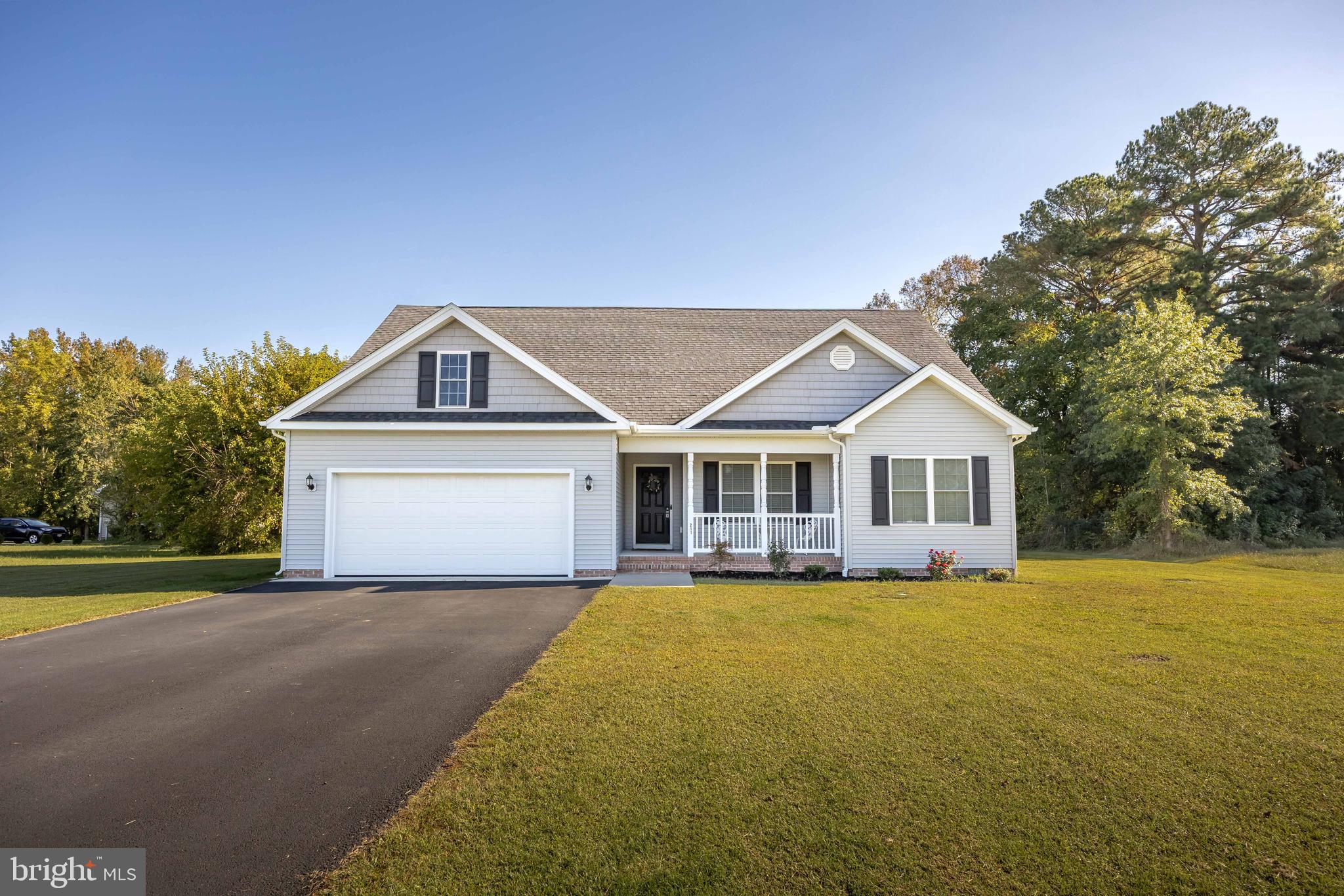 211 Moonglow Road Fruitland, MD 21826 - Photo 1 of 67 a view of a house with a big yard and large trees