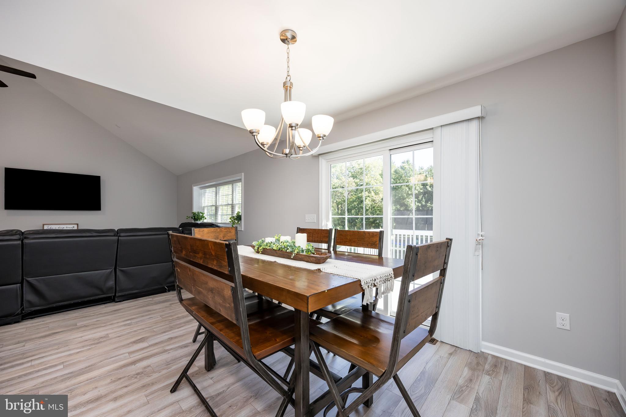 211 Moonglow Road Fruitland, MD 21826 - Photo 11 of 67 a view of a dining room with furniture window and wooden floor