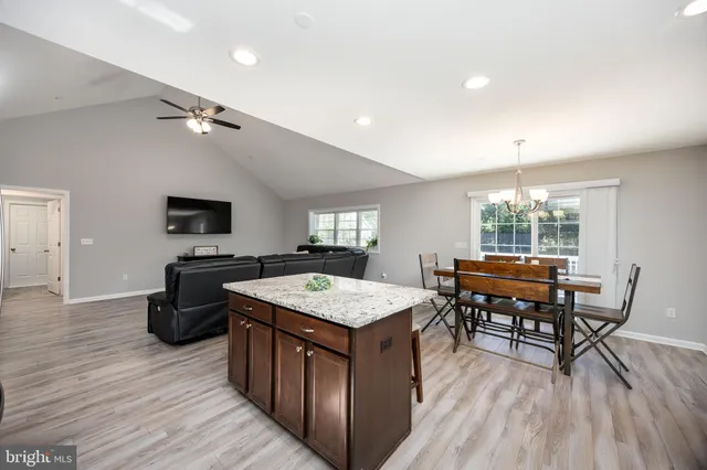 a bedroom with a bed and a television