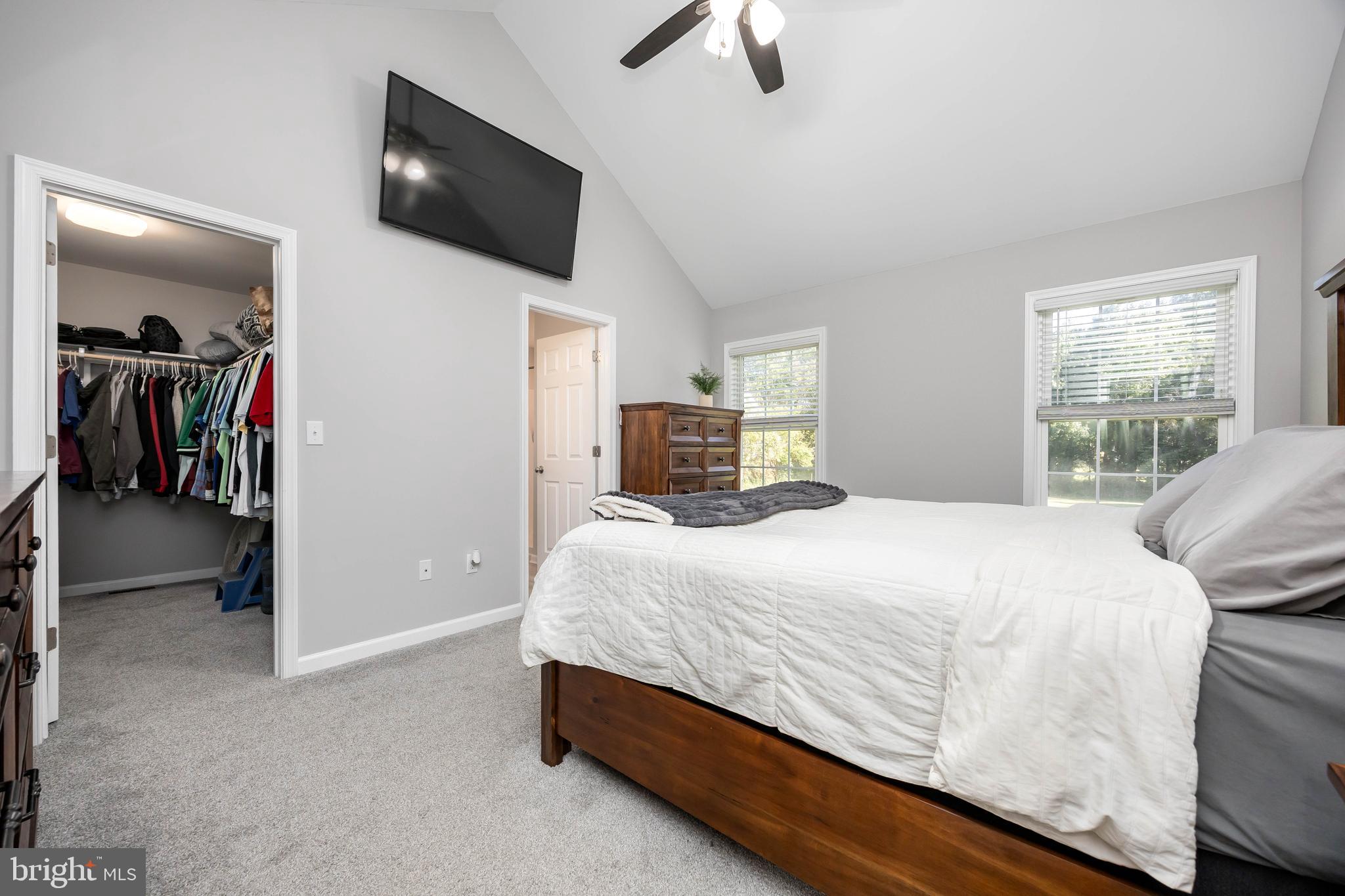 211 Moonglow Road Fruitland, MD 21826 - Photo 20 of 67 a bedroom with a bed and a flat tv screen on the dresser