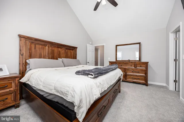 a bathroom with a sink a toilet and a window