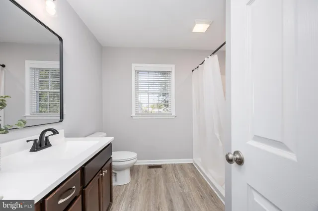 a view of a small space with a window and a shower curtain