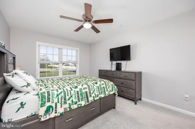 a view of staircase with white walls and a window