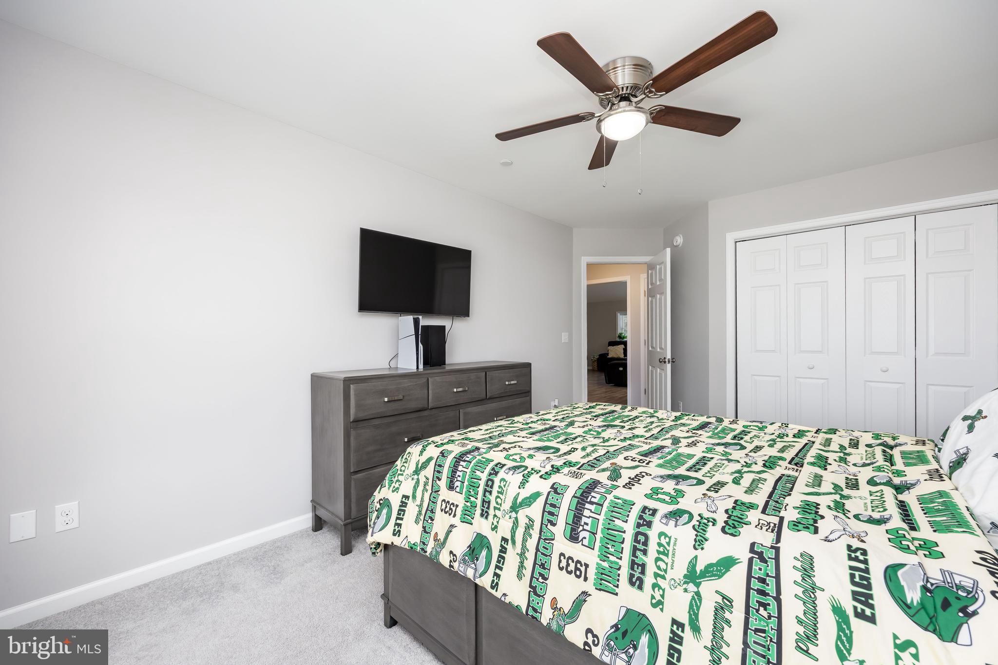 211 Moonglow Road Fruitland, MD 21826 - Photo 39 of 67 a bedroom with a bed and a flat screen tv