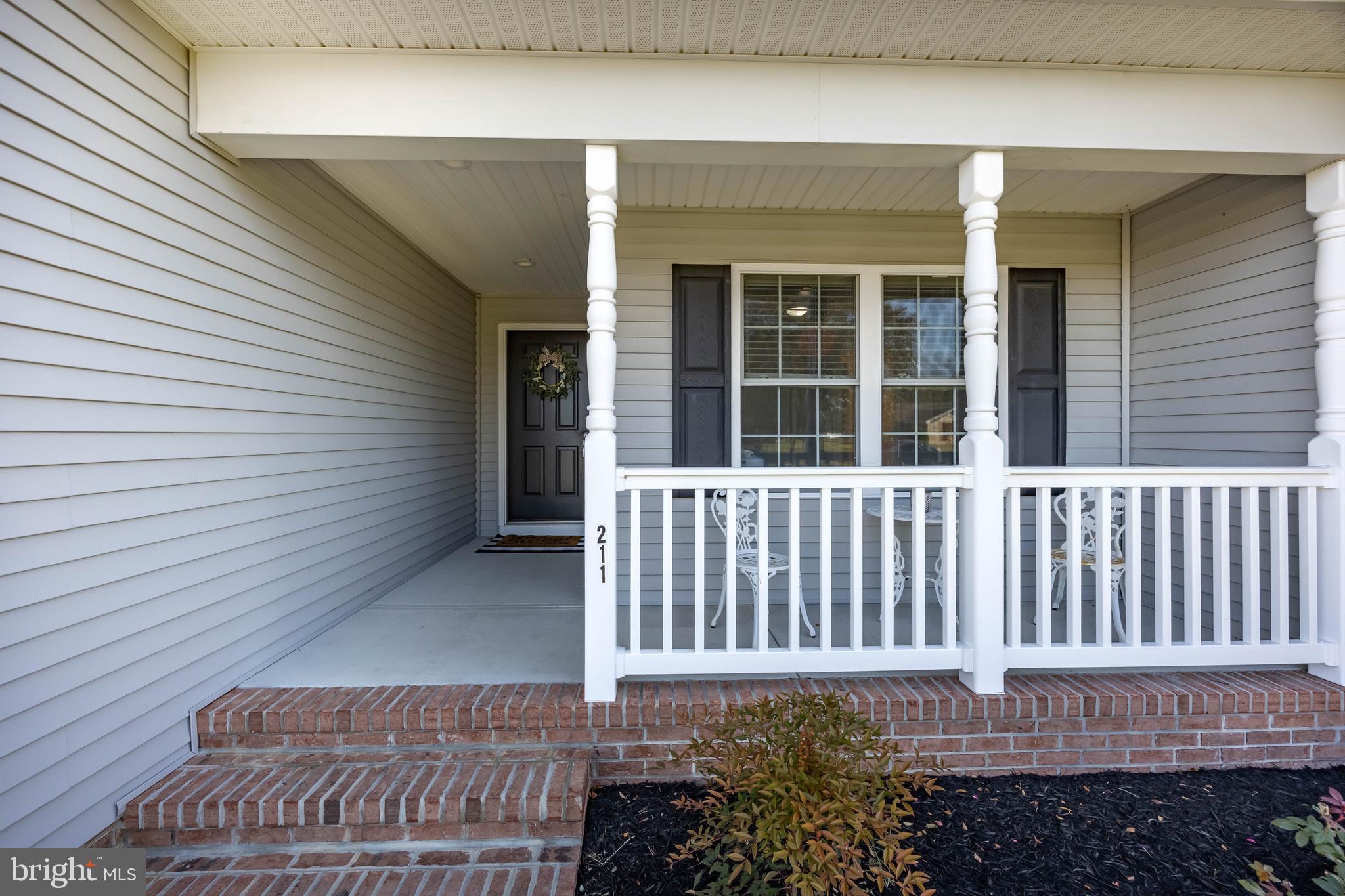 211 Moonglow Road Fruitland, MD 21826 - Photo 4 of 67 a view of a house with a small yard and wooden floor and fence