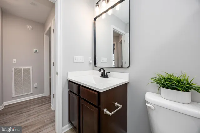 a balcony with wooden floor and lake view
