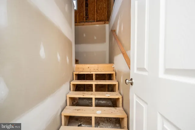 a view of deck with wooden floor and fence next to a yard