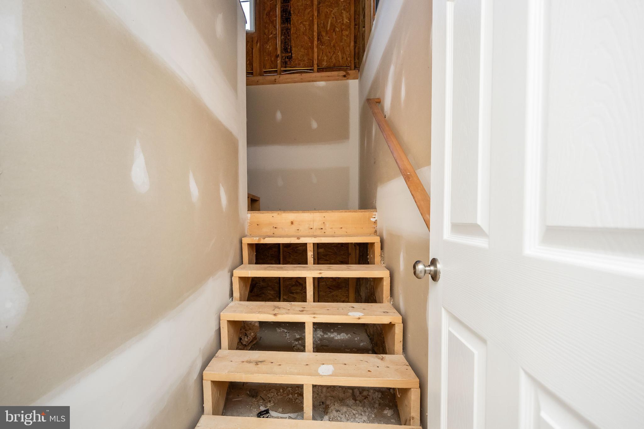 211 Moonglow Road Fruitland, MD 21826 - Photo 44 of 67 a view of staircase with white walls and a window
