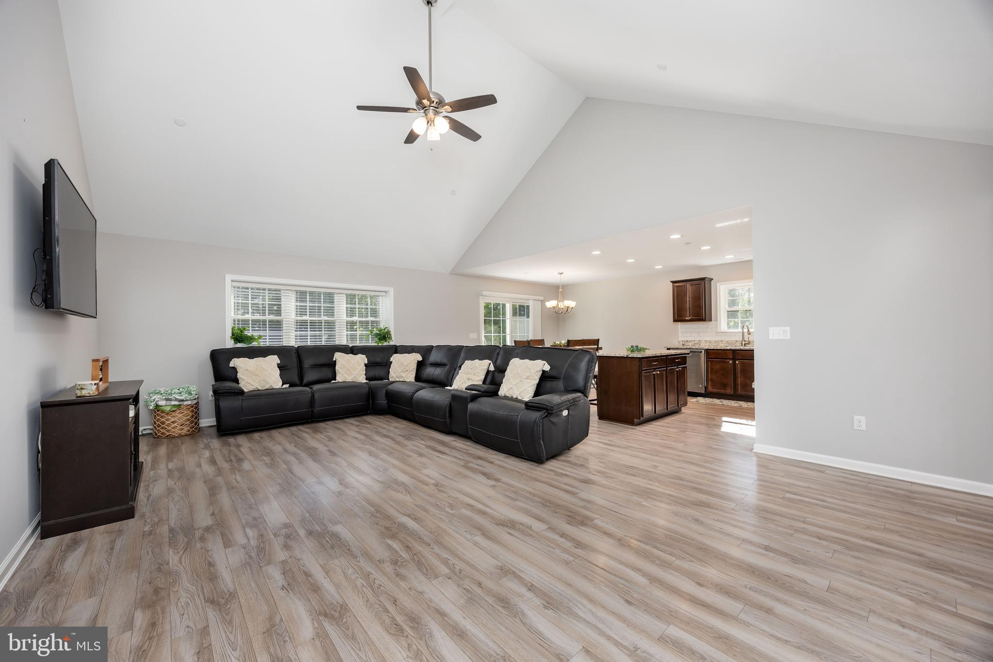 211 Moonglow Road Fruitland, MD 21826 - Photo 5 of 67 a living room with furniture and a flat screen tv