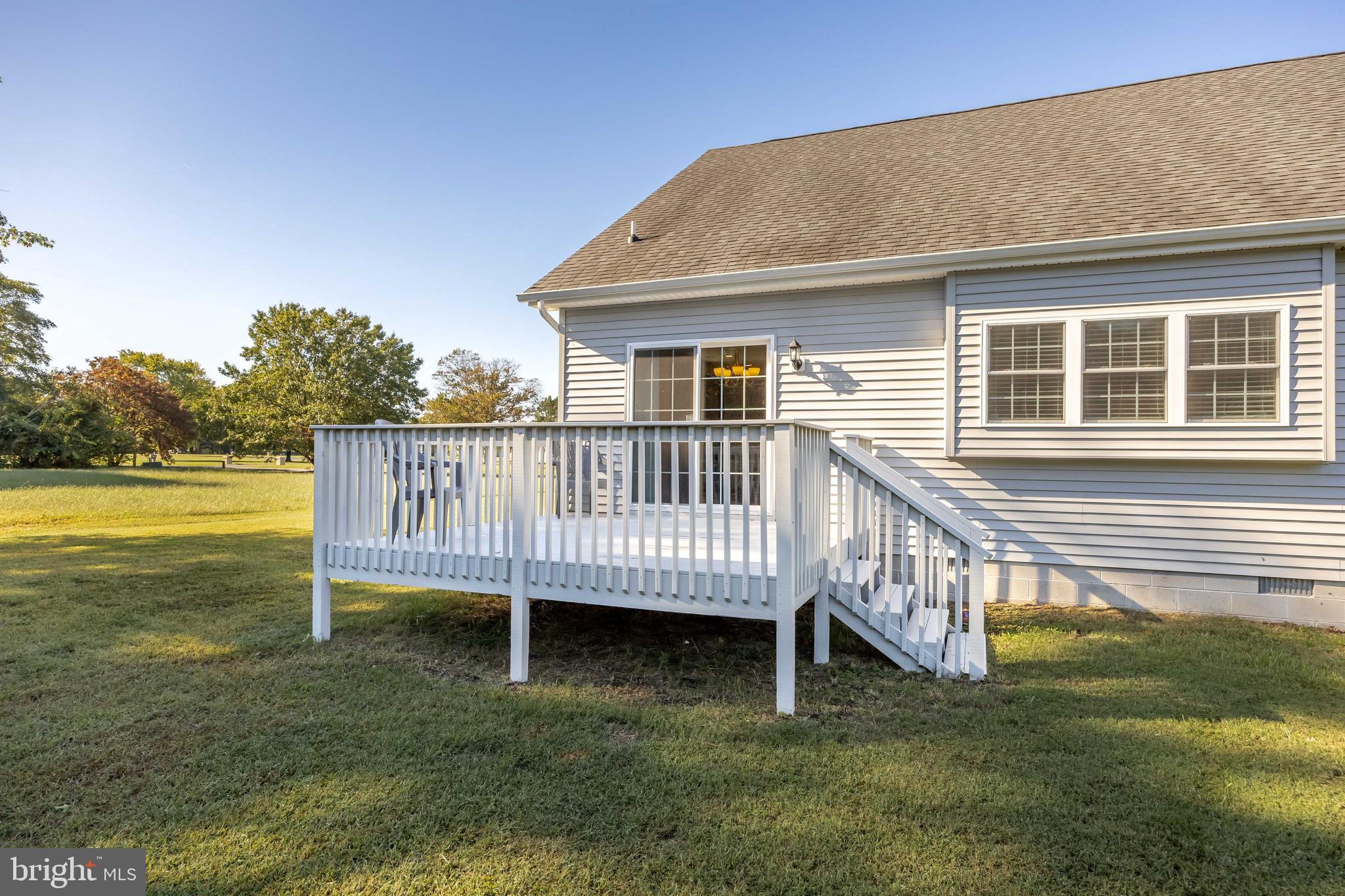 211 Moonglow Road Fruitland, MD 21826 - Photo 61 of 67 a view of a house with a deck and a yard