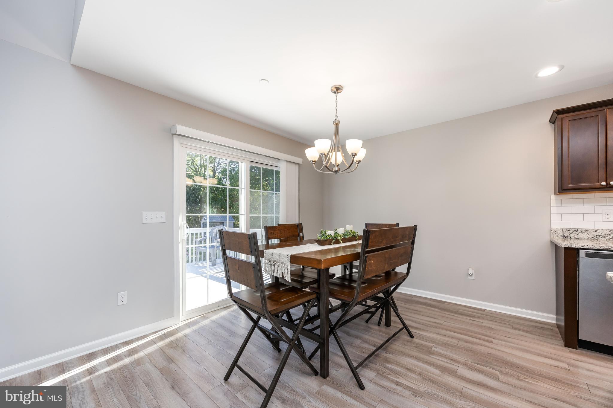 211 Moonglow Road Fruitland, MD 21826 - Photo 9 of 67 a view of a dining room with furniture window and wooden floor