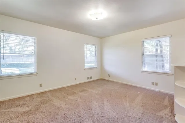 a bathroom with a sink mirror and shower
