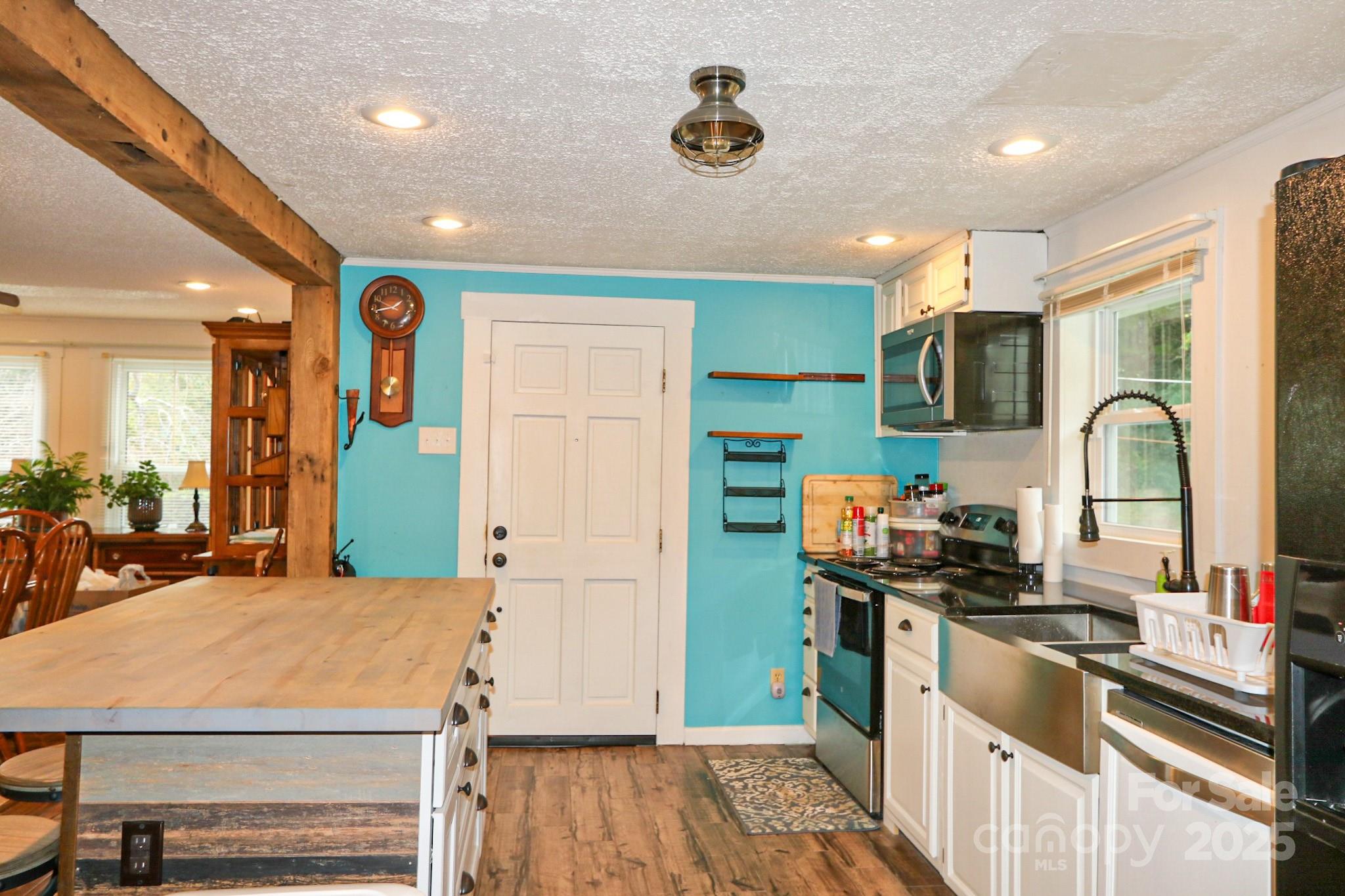 11979 Sparta Road McGrady, NC 28649 - Photo 12 of 48 a kitchen with a sink appliances and cabinets