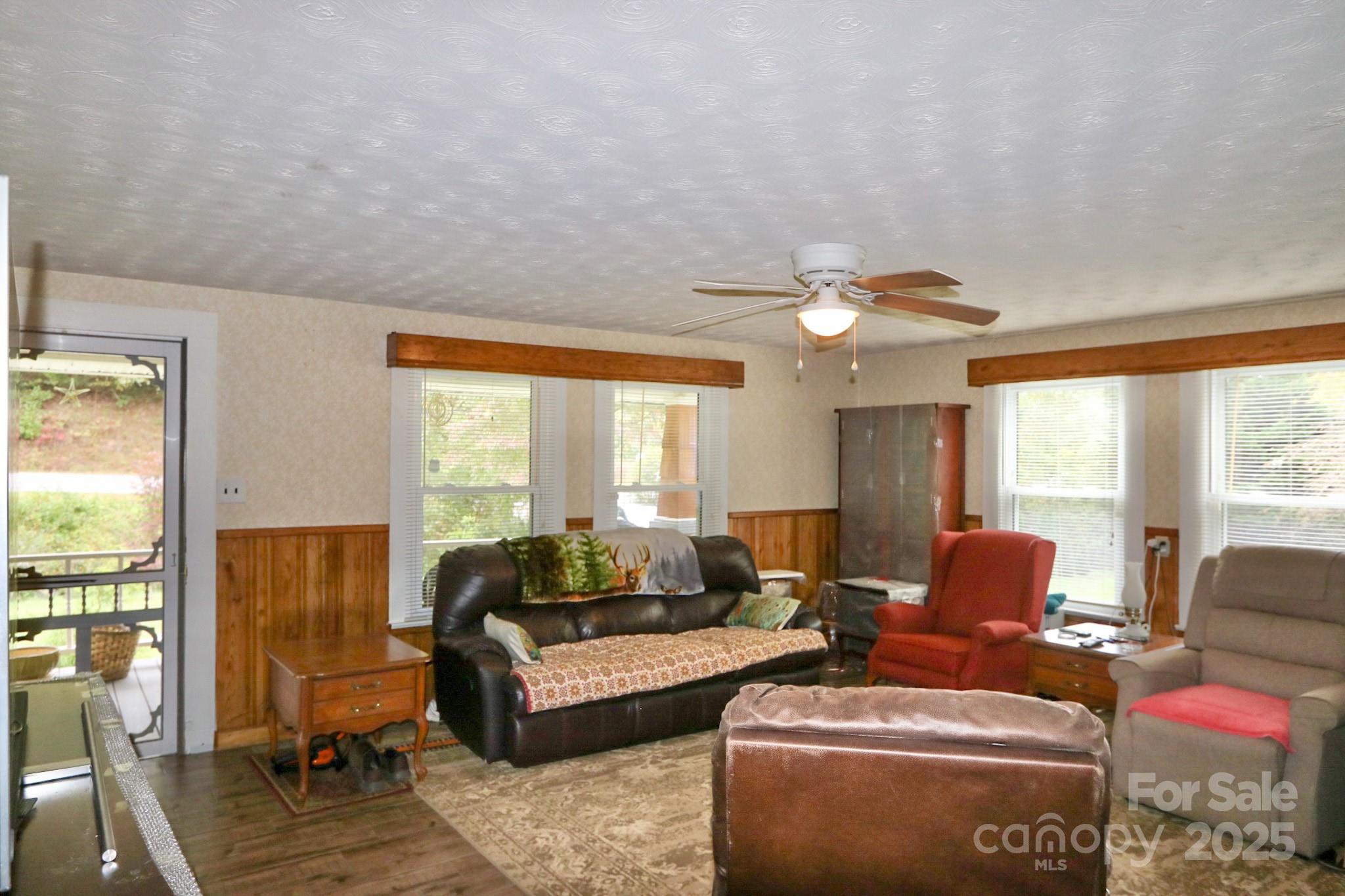 11979 Sparta Road McGrady, NC 28649 - Photo 20 of 48 a living room with furniture and a large window