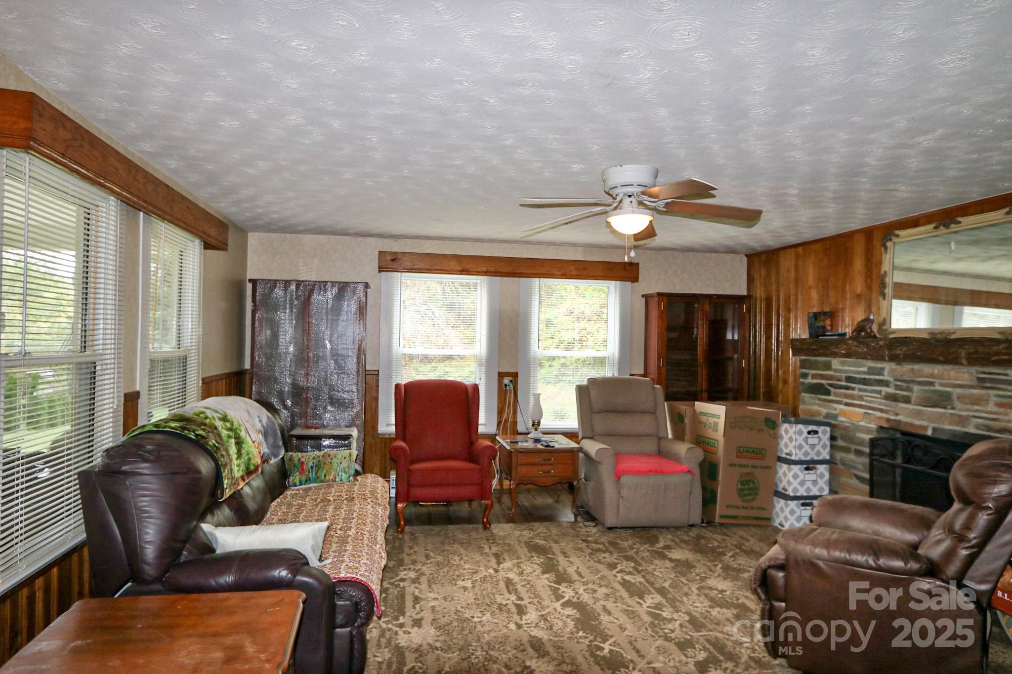 11979 Sparta Road McGrady, NC 28649 - Photo 21 of 48 a living room with furniture fireplace and flat screen tv